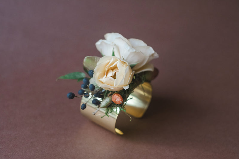 Peach and white flowers on gold bracelet for a la Carte Weddings Madison Huntsville AL.  The Dreamt Garden is a modern retail flower shop in downtown Madison, AL.