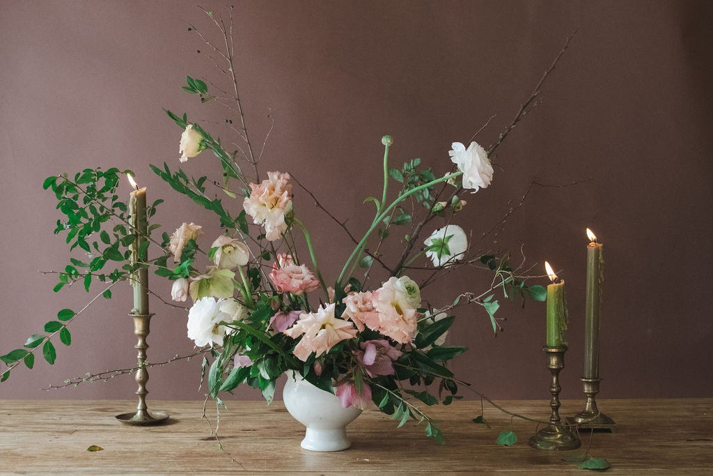 Large whismical flower arrangement with roses, ranunculus, and wild greenery, for A la Carte Wedding menu by The Dreamt Garden in Madison, AL.