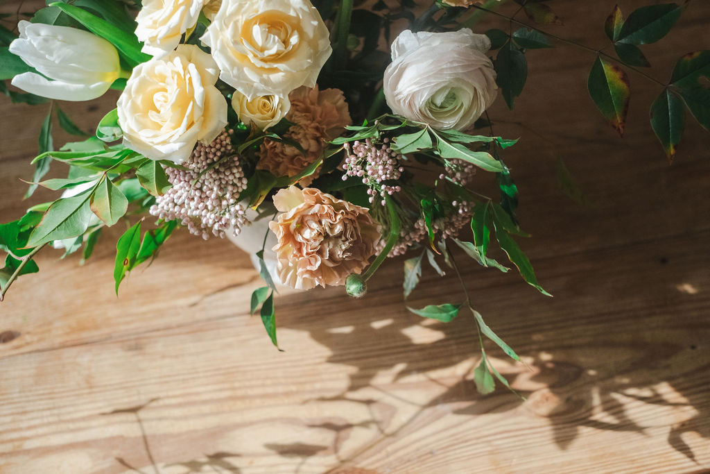 Close up of whimsical garden floral arrangement by The Dreamt Garden, a modern flower shop in historic Madison AL.  Customers order for weddings and events.